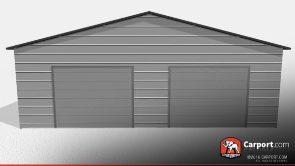 Double wide garage building with grey walls, two garage doors and black trim.