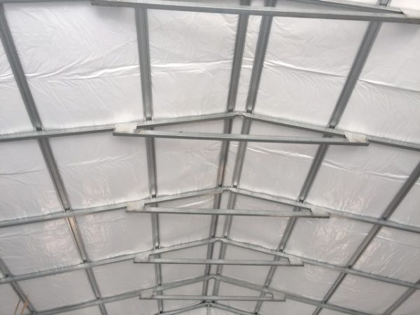 Framing of a commercial metal garage, insulation, roof.
