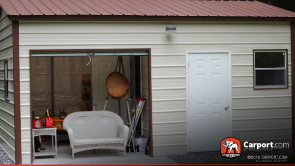 The interior is visible of this metal garage workshop.