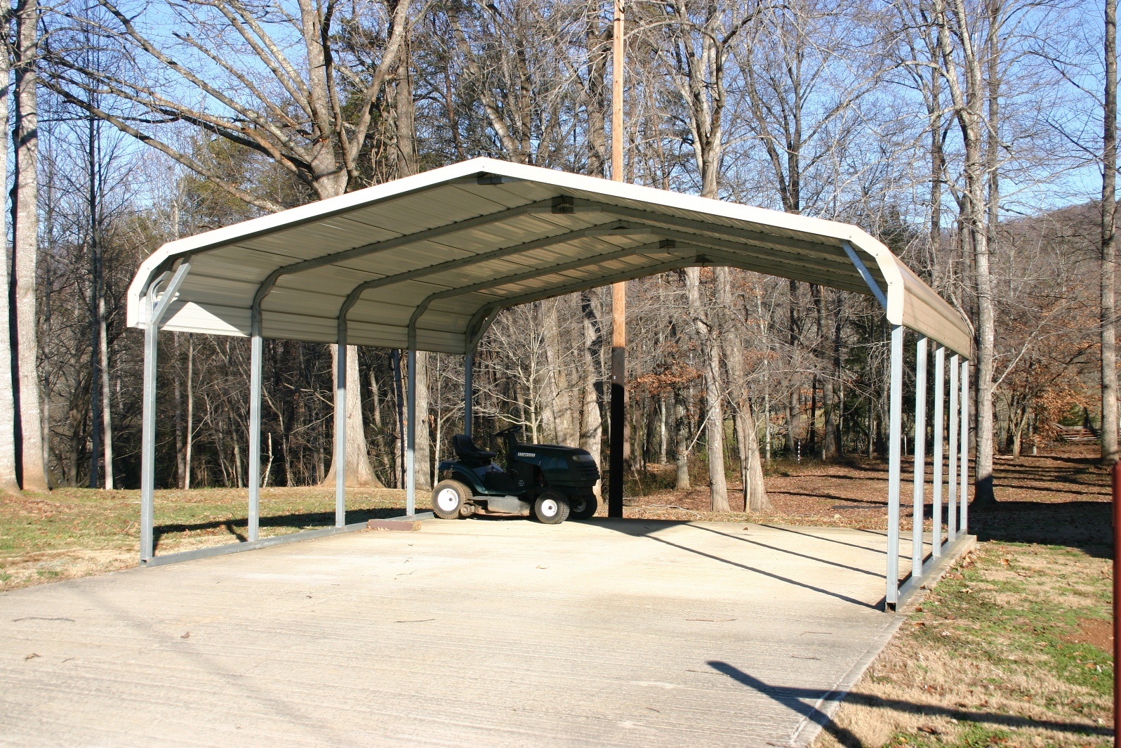 double-wide-two-car-carport Double wide two car carport with tan roof and white trim.