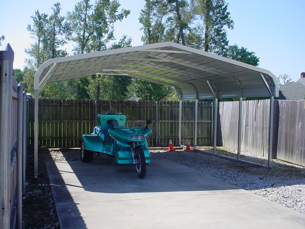 motorcycle-cover-carport Motorcylce carport cover with white trim and room for two carports.