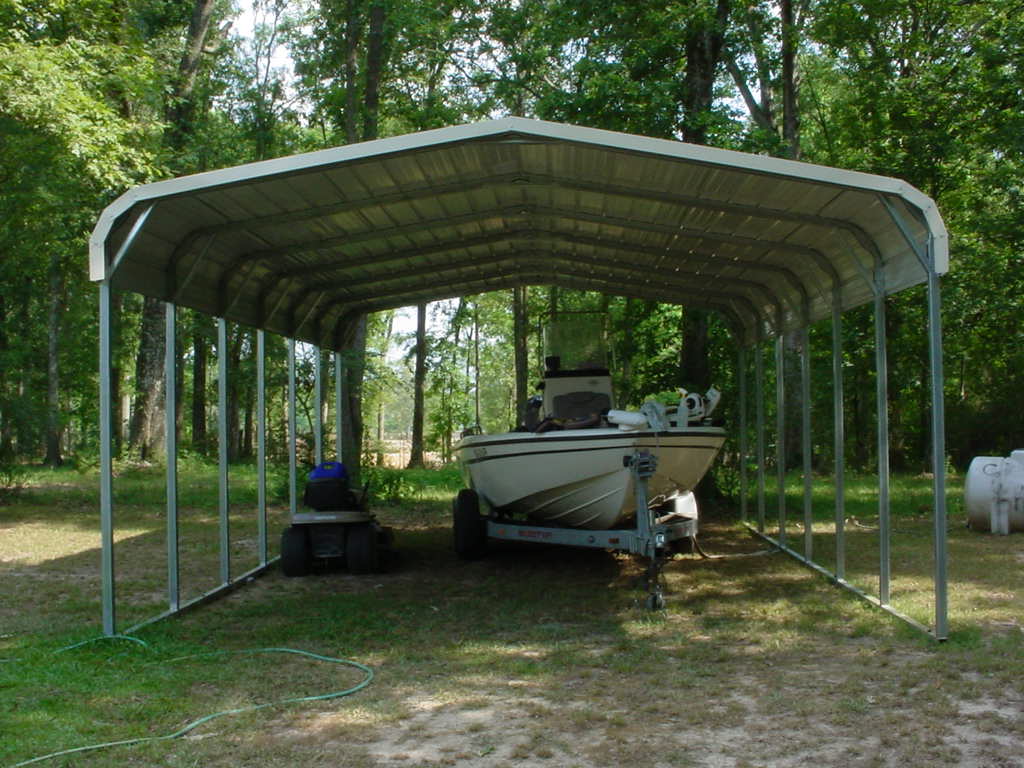 Single wide tall carport with boat parked underneath.