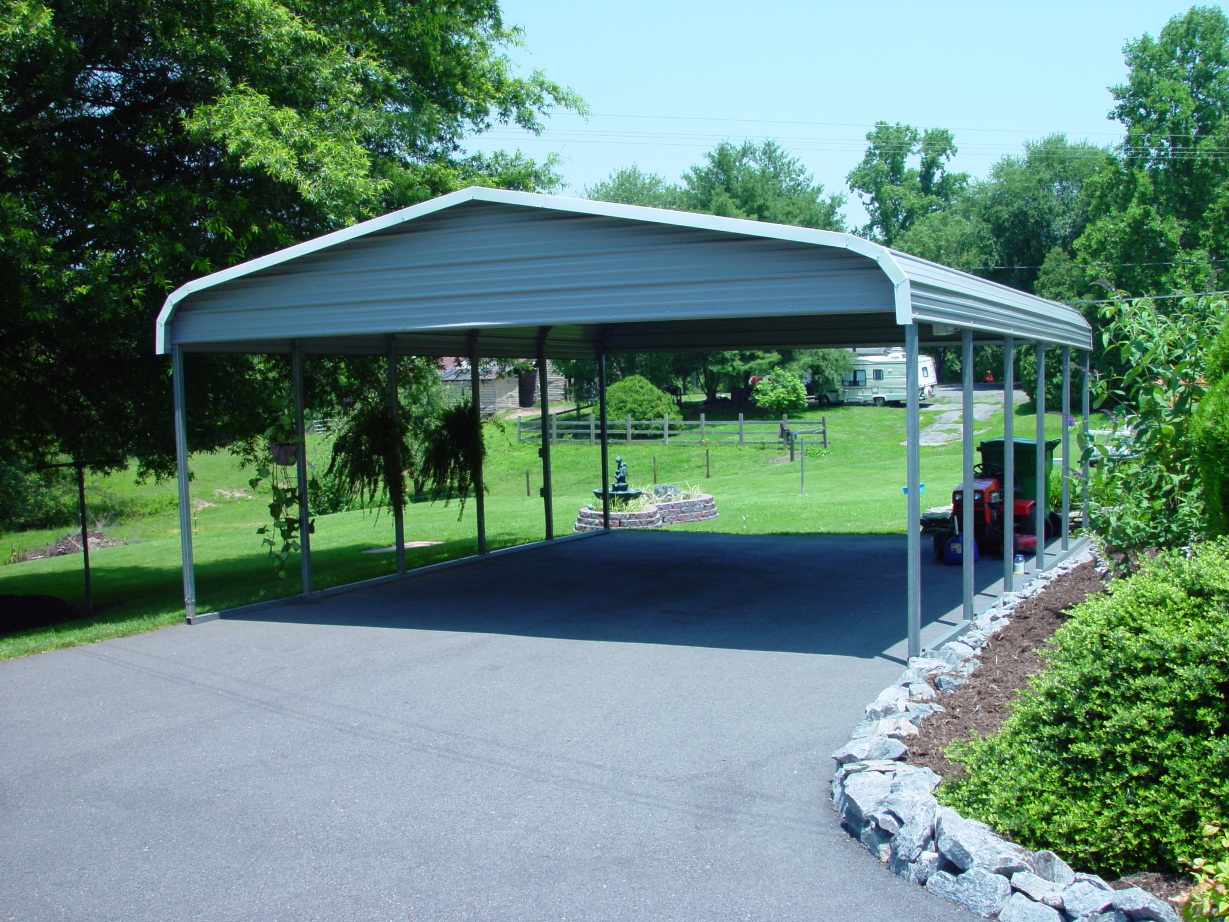 Grey Double Wide Ski Boat Metal Cover Grey double wide ski boat metal cover with gables and white trim.
